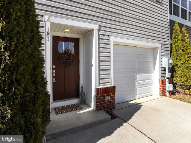 entrance to property featuring a garage