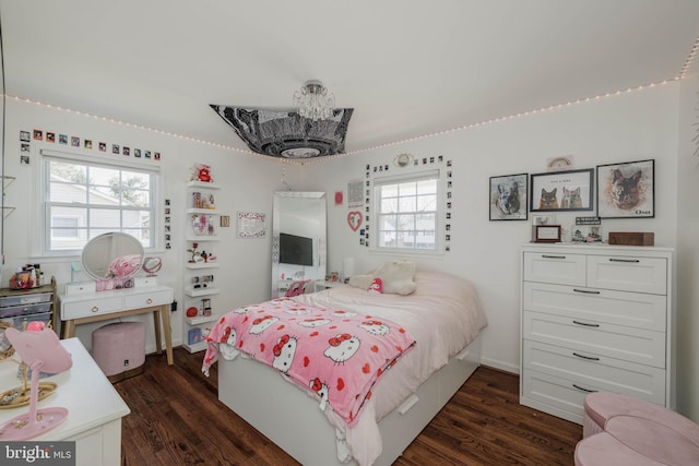 bedroom with dark wood-style floors