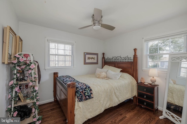 bedroom featuring a ceiling fan, dark wood-style flooring, and baseboards