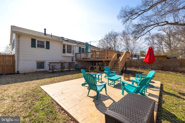 view of patio featuring a deck, a fenced backyard, and stairs