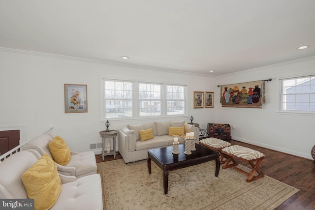 living room with recessed lighting, visible vents, ornamental molding, wood finished floors, and baseboards