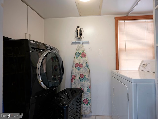 laundry room with separate washer and dryer