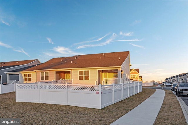 view of front of house with fence