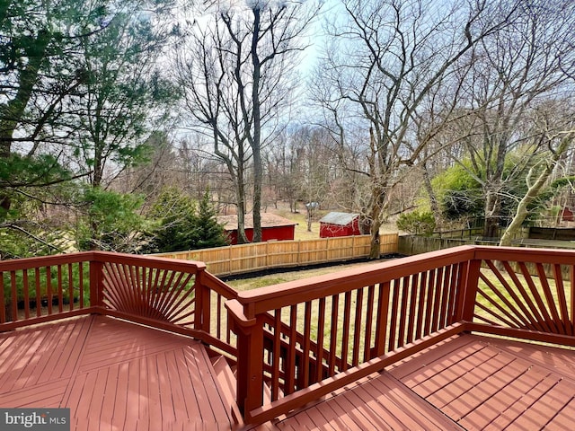 wooden terrace featuring fence