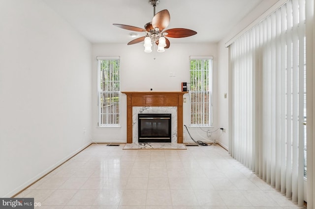 7315 Serenade Cir, Clinton, MD 20735 - unfurnished living room with a ceiling fan, plenty of natural light, a fireplace, and baseboards