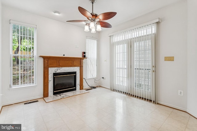 7315 Serenade Cir, Clinton, MD 20735 - unfurnished living room with ceiling fan, baseboards, and a high end fireplace