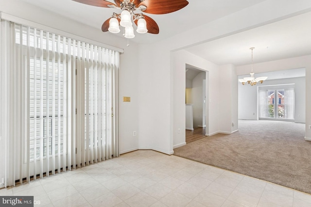 7315 Serenade Cir, Clinton, MD 20735 - carpeted spare room with a chandelier, ceiling fan, and baseboards