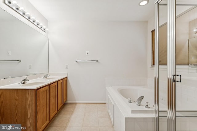 7315 Serenade Cir, Clinton, MD 20735 - bathroom with double vanity, a bath, tile patterned flooring, a stall shower, and baseboards