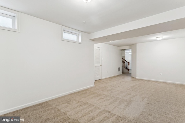 7315 Serenade Cir, Clinton, MD 20735 - below grade area with baseboards, light carpet, and stairway