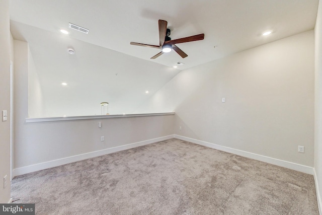 additional living space with lofted ceiling, carpet, visible vents, and baseboards