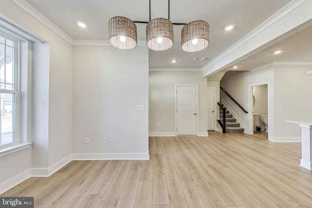 empty room with baseboards, stairway, ornamental molding, light wood-type flooring, and recessed lighting