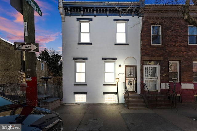 view of front of home featuring brick siding