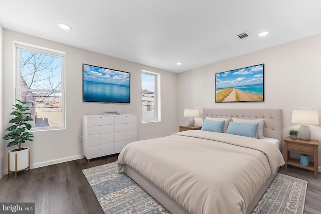 bedroom with visible vents, wood finished floors, and recessed lighting