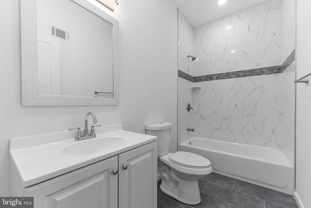 bathroom featuring toilet, vanity, visible vents, shower / bathing tub combination, and tile patterned floors