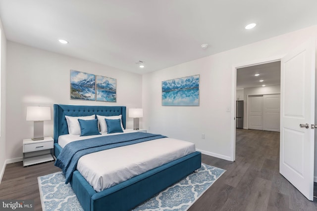 bedroom featuring dark wood-style floors, recessed lighting, and baseboards