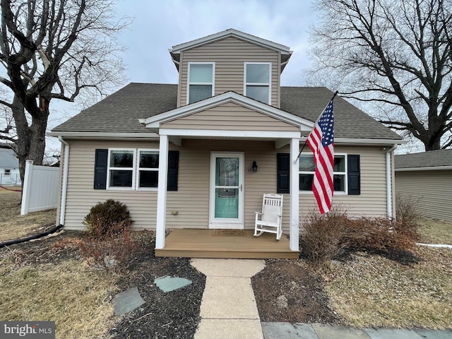 view of front of property with roof with shingles