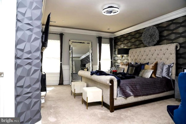 bedroom with wallpapered walls, crown molding, and carpet