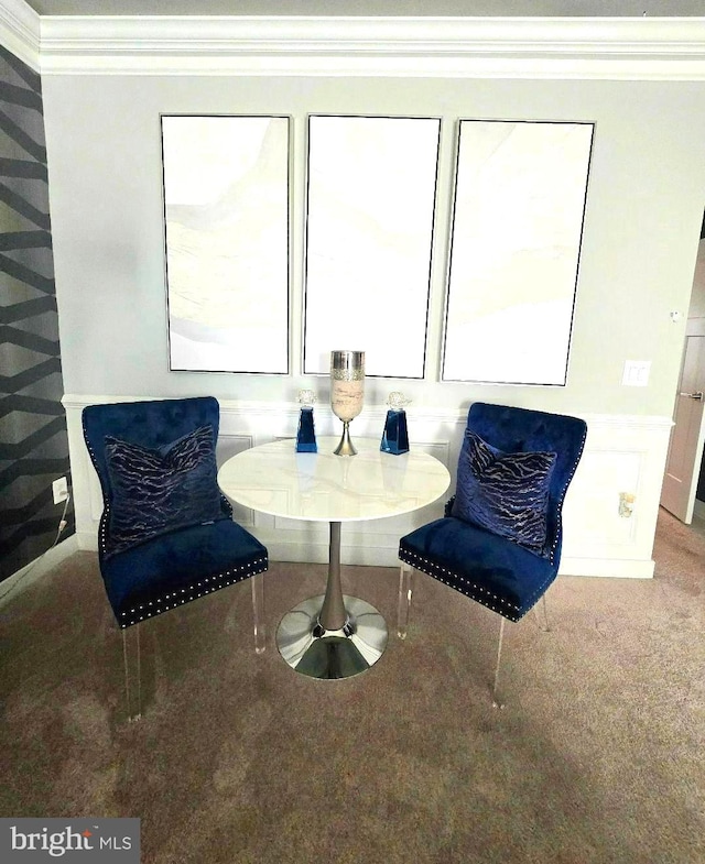 sitting room featuring wainscoting, carpet floors, and ornamental molding