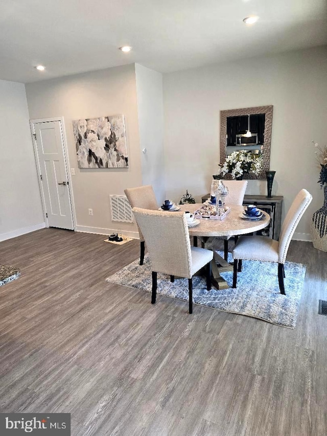 dining space featuring visible vents, recessed lighting, baseboards, and wood finished floors