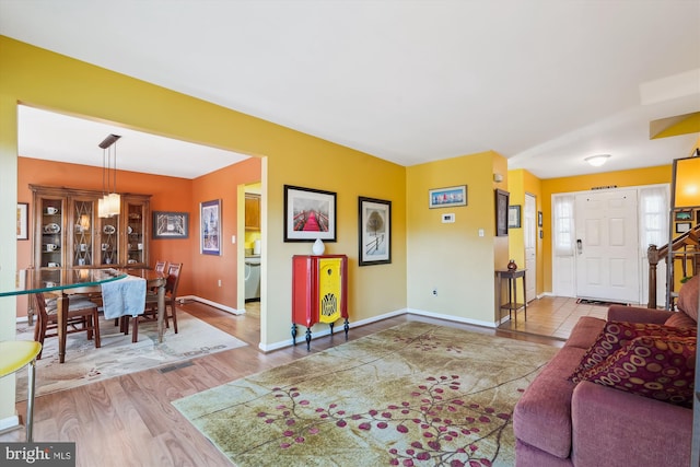 living area featuring wood finished floors and baseboards