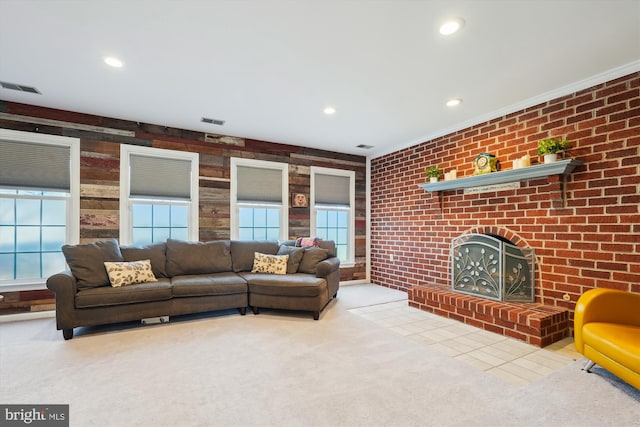 carpeted living area with recessed lighting, a fireplace, visible vents, and ornamental molding