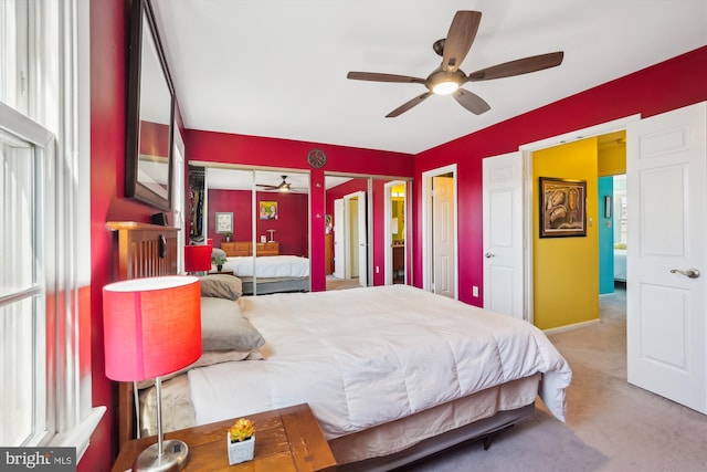 bedroom featuring baseboards, carpet floors, and ceiling fan