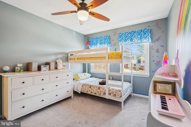 bedroom with light carpet and a ceiling fan