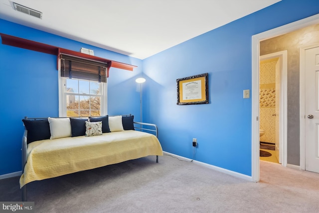 carpeted bedroom with visible vents and baseboards