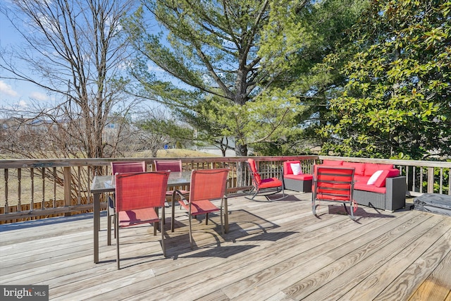 deck with outdoor dining space