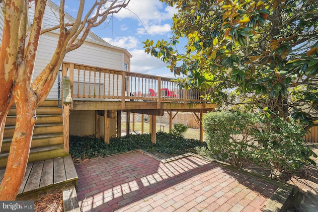 view of patio / terrace with a deck and stairs