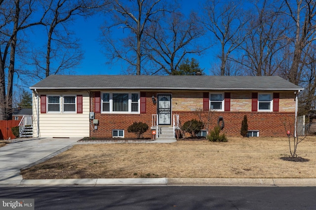 view of front of property featuring entry steps and brick siding