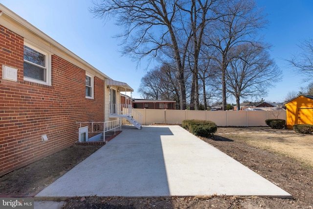 view of patio featuring fence