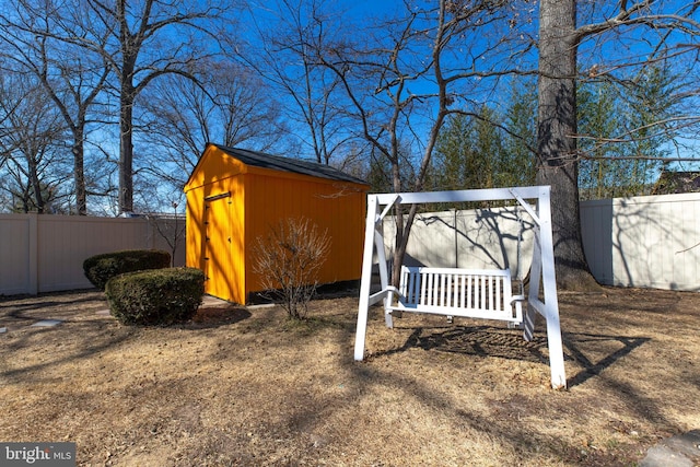 view of shed featuring fence