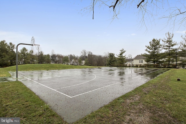 view of sport court featuring a lawn and community basketball court