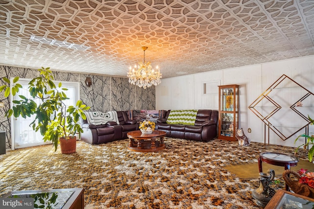 carpeted living area featuring a chandelier and an ornate ceiling