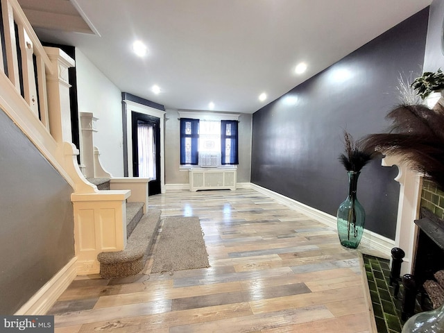 foyer featuring stairway, recessed lighting, light wood-style flooring, and baseboards