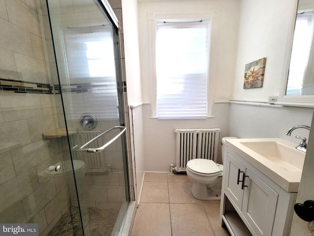 full bath featuring a stall shower, radiator, toilet, tile patterned floors, and vanity