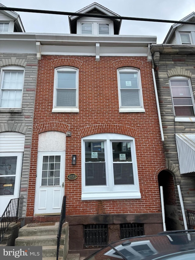 multi unit property featuring brick siding