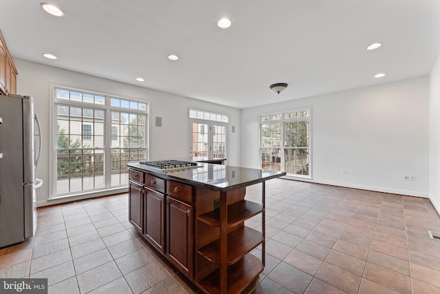 kitchen with tile patterned flooring, recessed lighting, appliances with stainless steel finishes, french doors, and open shelves