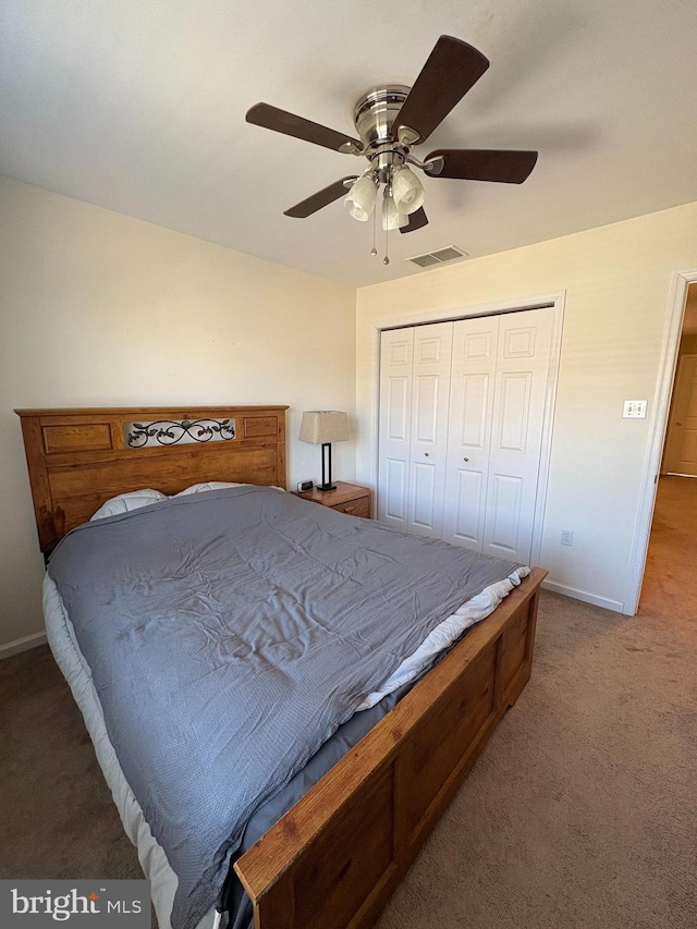 bedroom featuring carpet, a closet, visible vents, ceiling fan, and baseboards