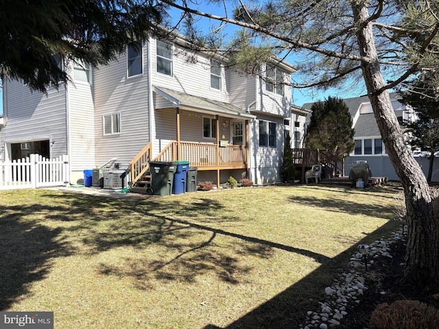 view of yard featuring fence and a wooden deck