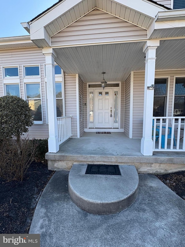 entrance to property with covered porch