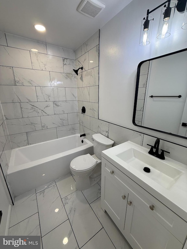 bathroom with marble finish floor, visible vents, shower / bathing tub combination, toilet, and vanity