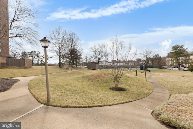 view of property's community with a lawn