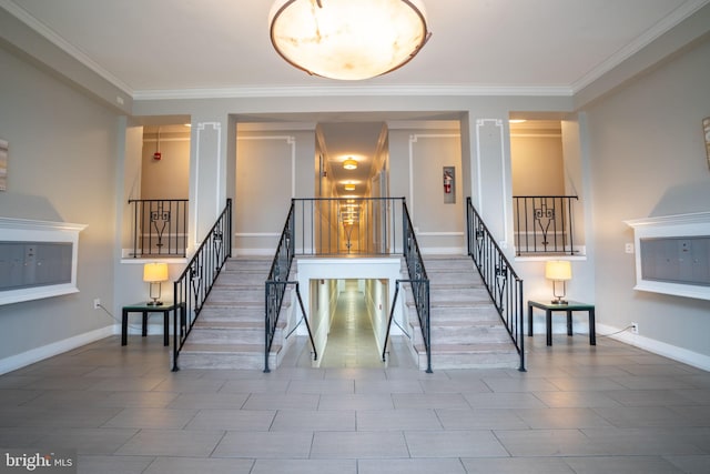 stairway with crown molding and baseboards