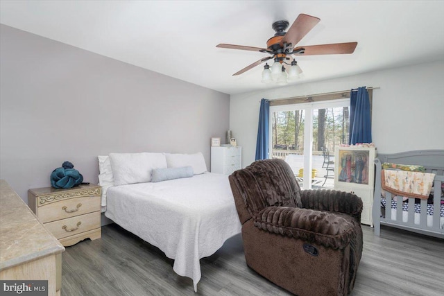 bedroom with a ceiling fan and wood finished floors