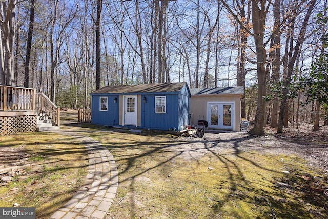 view of outbuilding with french doors and an outdoor structure