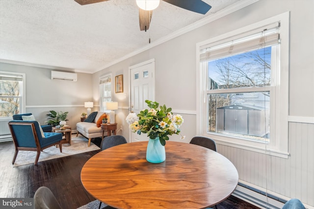 dining room with dark wood-style floors, a healthy amount of sunlight, a textured ceiling, and a wall mounted AC