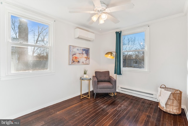 living area with a wall unit AC, a baseboard heating unit, dark wood-type flooring, baseboards, and crown molding