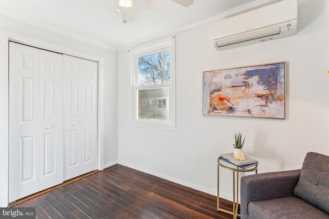 unfurnished room featuring dark wood-style floors, crown molding, a wall mounted AC, and baseboards